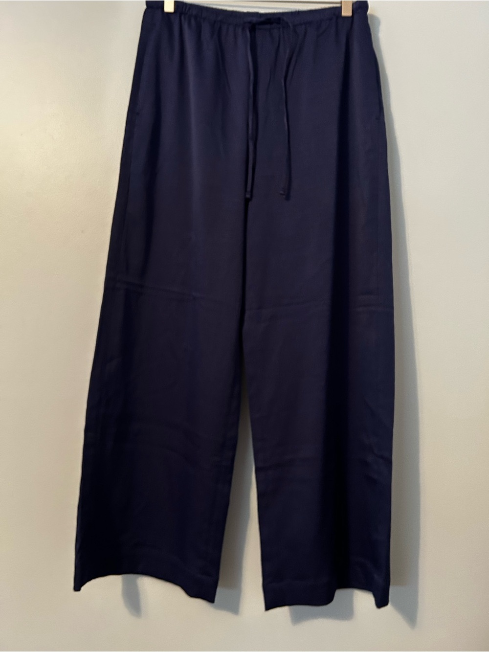 Pull on pant style with elastic waist.  Side  pockets size M